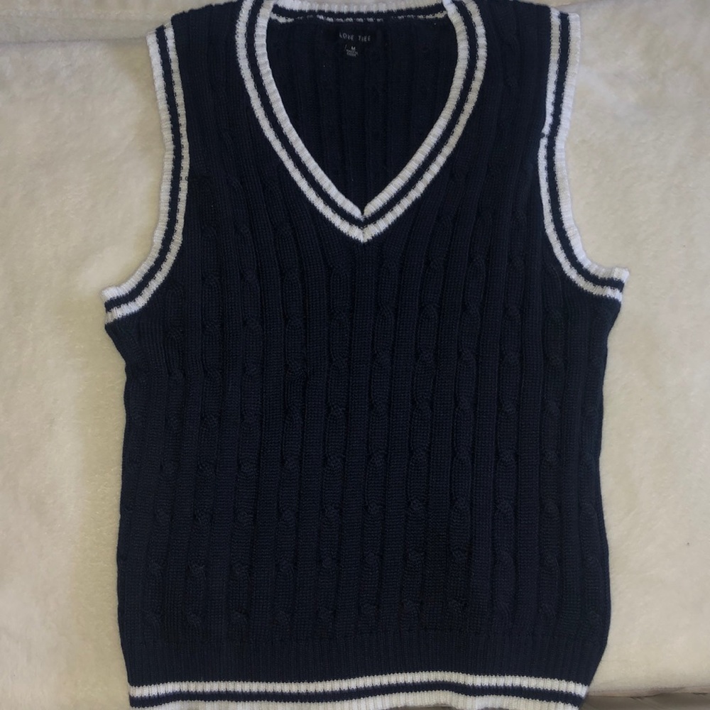 Blue vest, brand Love Tree
it is in good used condition